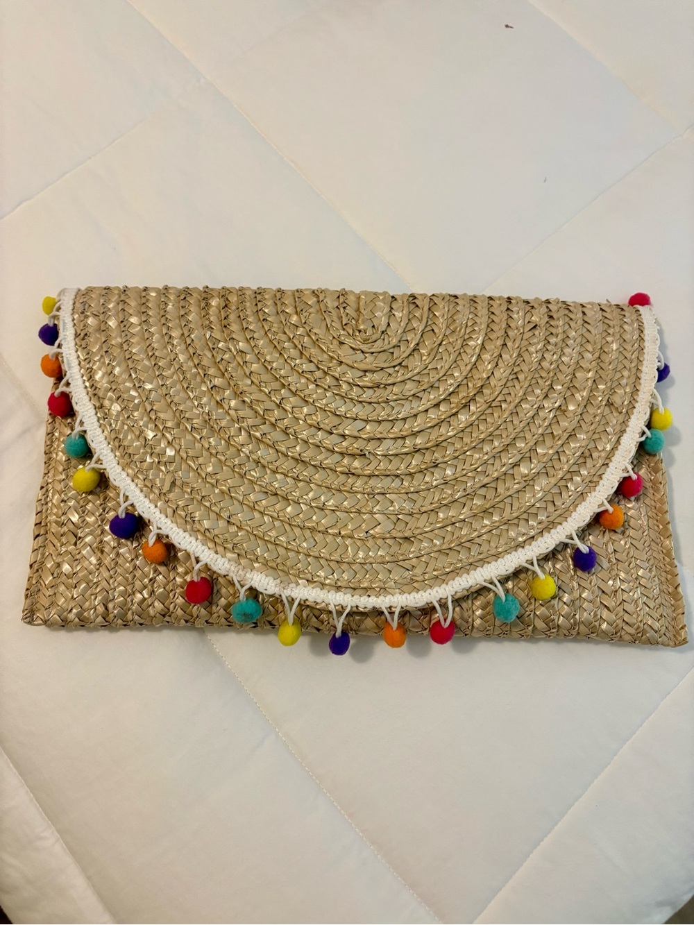 Woven Straw Clutch with Multicolor Pom Pom
Trim
